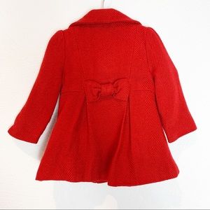 red coat baby girl